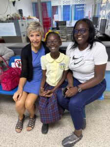 Dr Isaac with Miracle, 12 years old, and mom 